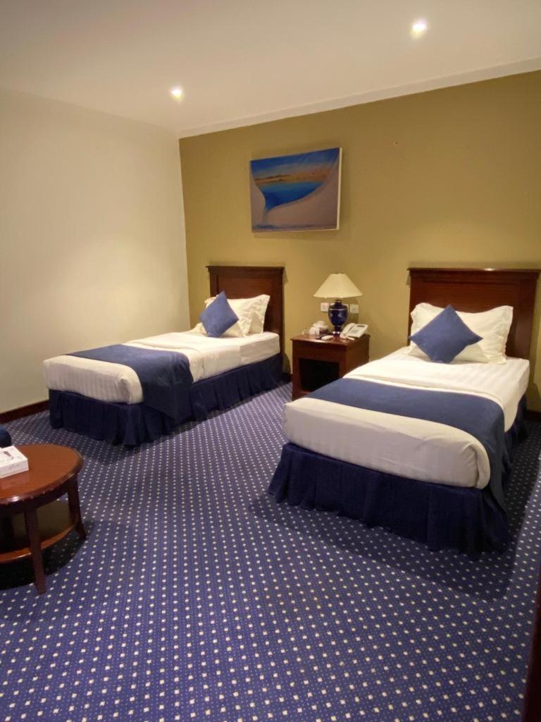 Onizah Hotel Unaizah Buitenkant foto