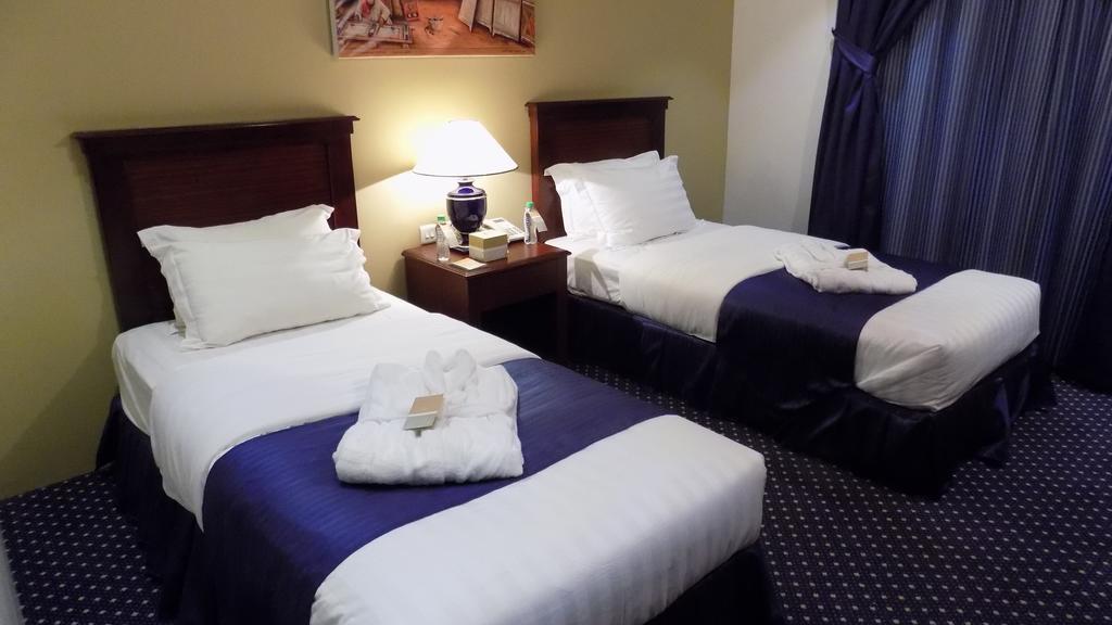 Onizah Hotel Unaizah Kamer foto