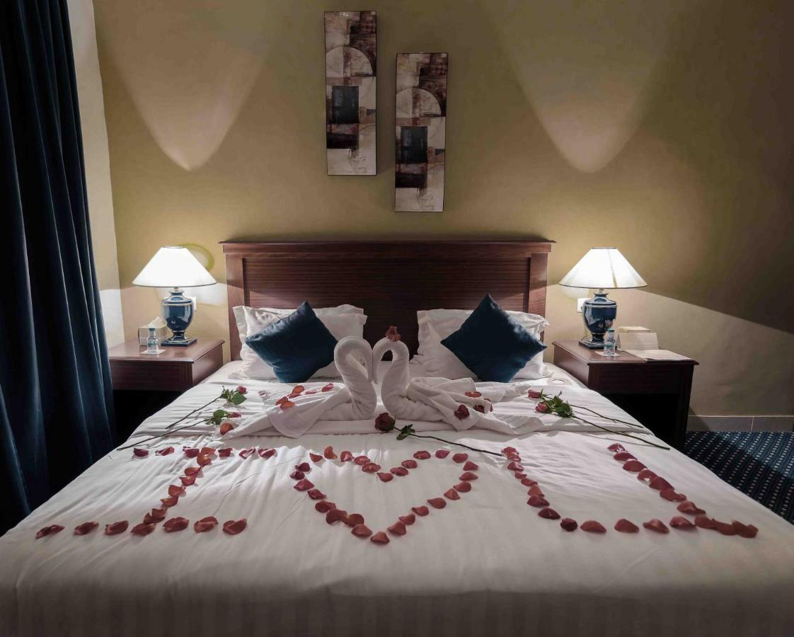 Onizah Hotel Unaizah Buitenkant foto